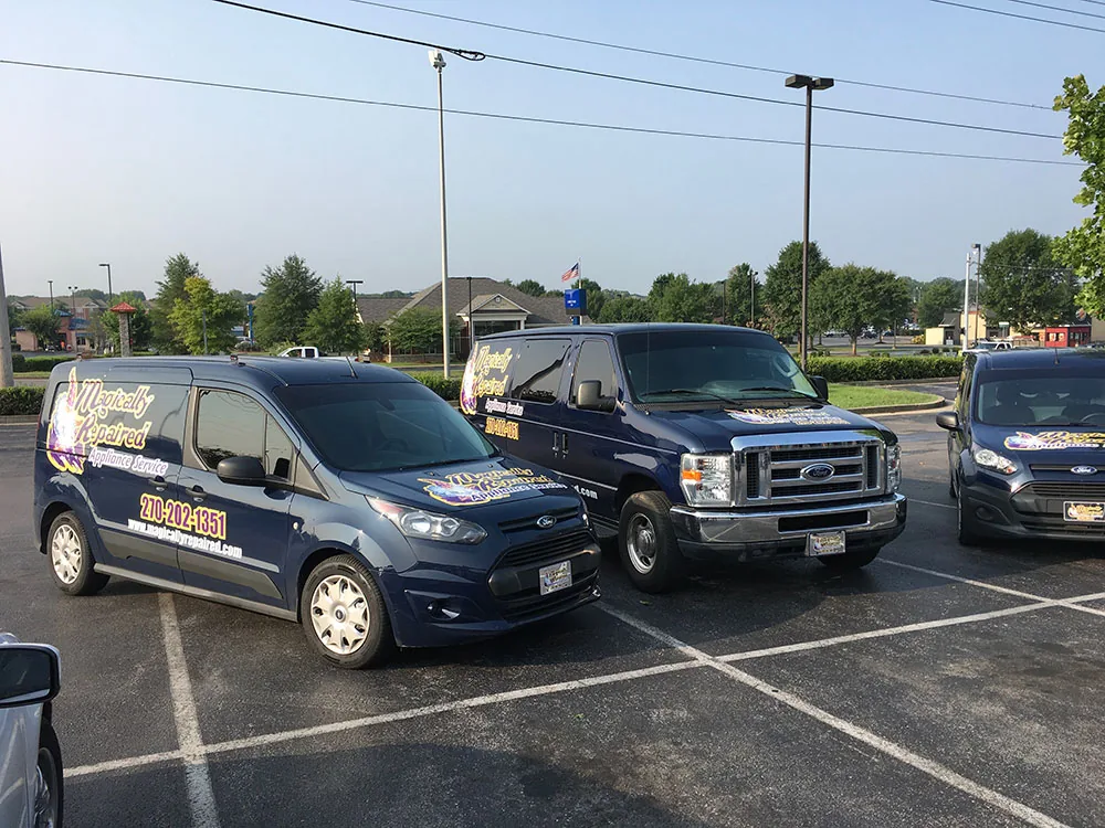 Magically Repaired service vans parked in a row